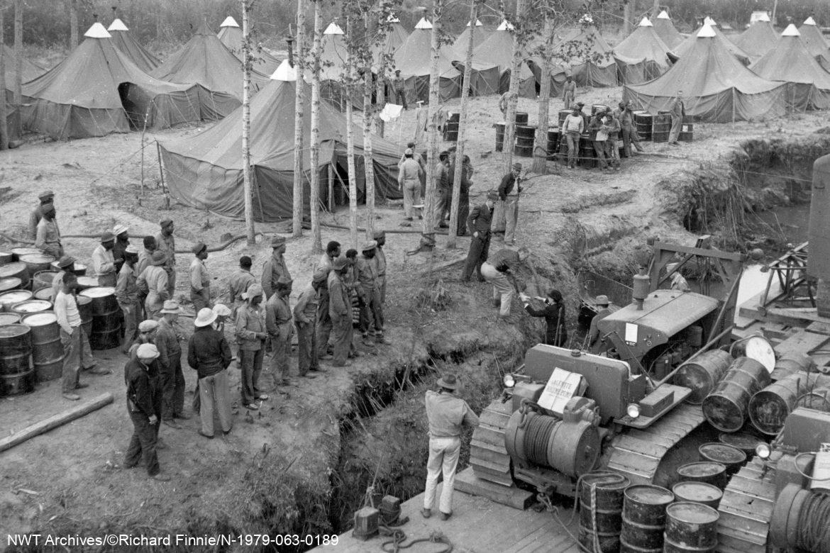 Equipment barge alongside U.S. Army camp at Slave River Delta, 1942.