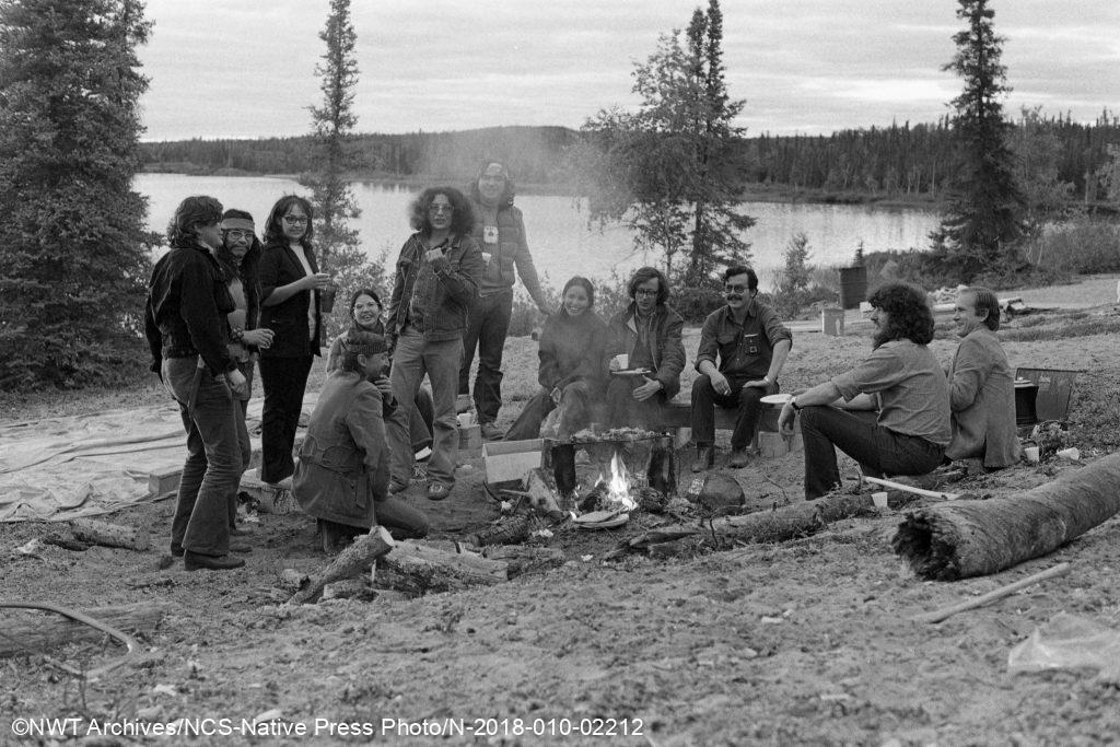 Charles Overvold, James Wah-shee, Bea Goldney (St. Arneault), Tapwe Chretien, Gail Cyr, George Erasmus, Richard Cadieux, Gina Blondin, Mel Watkins, Rick Hardy, Peter Puxley, and Gerald Sutton. Indian Brotherhood of the NWT strategy meeting at Consolation Lake, 1974.